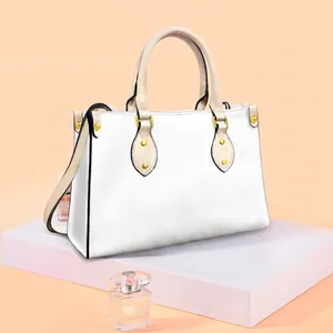 White pebbled leather tote with Halloween skull print and gold metallic hardware