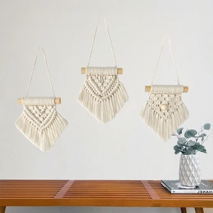 Set of three handmade cotton macrame wall hangings with wood rods for Nordic home decor