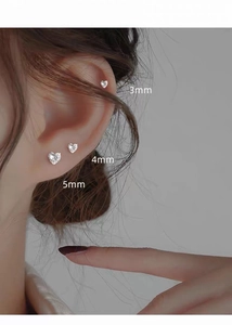 Detailed size comparison of 3mm, 4mm, and 5mm silver heart stud earrings on model