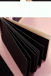 Detail of the thick black inner pages and dual wire-o binding of the creative scratch pad