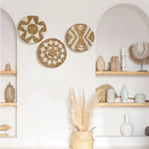Set of 3 handmade woven seagrass wall baskets with bohemian geometric star patterns