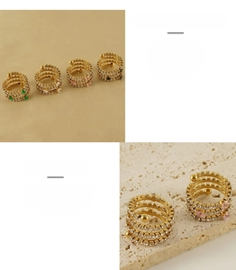 Detail of multi-layer spiral stainless steel rings with colorful zircon pavé crystals