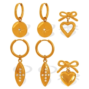 Vintage gold stainless steel earring set with heart, leaf and starburst dangles