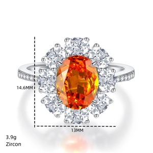 Close-up of orange oval zircon ring with 14.6mm by 13mm face and 3.9g weight details