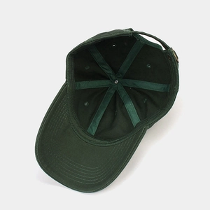 Dark green cotton baseball cap interior detail with reinforced stitching and adjustable strap