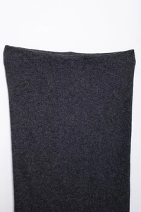 Close-up of dark grey knitted fabric showing detailed ribbed texture and top edge finish