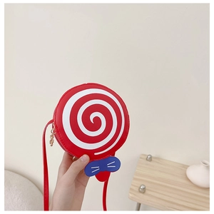 Detail of red and white lollipop shaped kids crossbody bag with blue bow accessory