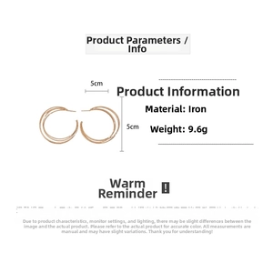 Detail view of multi-layer geometric C-shaped gold hoop earrings showing 5cm size