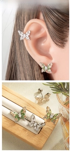 Detailed macro view of vintage butterfly earrings with micro-inlaid colored zircons