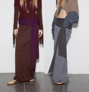 Detailed view of knitted maxi skirts featuring tie-waist design in brown and grey tones