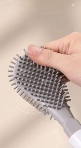 Macro shot of flexible grey TPR toilet brush head showing soft bristles and elastic material