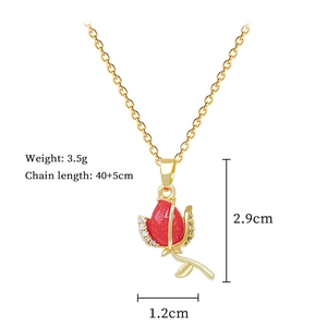 Macro shot of red rose pendant necklace with crystal accents and sizing details
