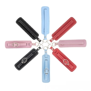 Detail view of colorful PU leather keychain straps with metal buckles in multiple colors