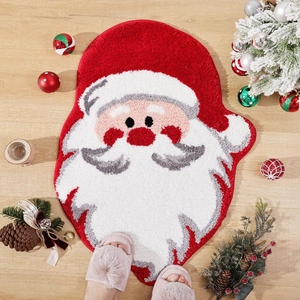 Macro detail of cartoon Santa Claus Christmas rug on wood floor with festive ornaments