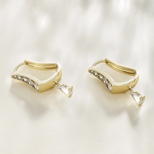 Elegant U-shaped gold earrings featuring pear-shaped zircon drops and diamond accents
