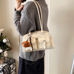 Retro cream pillow shoulder bag for women with glossy finish and cute plush bear charm