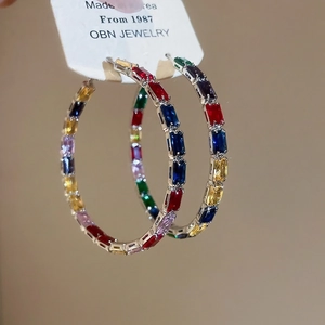 Chic gold hoop earrings with multi-colored rectangular cubic zirconia in a pave setting