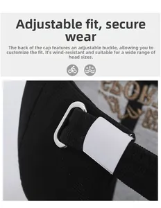 Close-up of the adjustable metal buckle and twill fabric texture on a black baseball cap