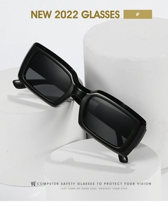 Detailed close-up of modern black square sunglasses on white geometric display stand