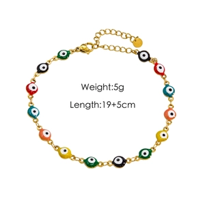 Detail of colorful enamel evil eye anklet with gold chain and lobster clasp closure