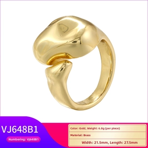 Detailed view of chunky irregular gold brass ring with textured geometric design and dimensions