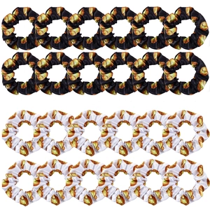 Set of 12 satin scrunchies in black and white with golden baseball pattern prints