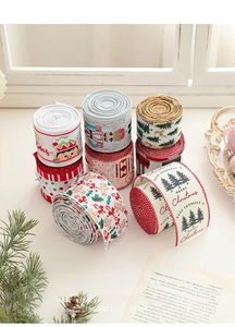 Rolls of Christmas ribbon with Nutcracker and Gingerbread Man prints for gift wrapping