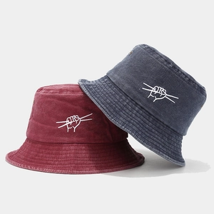 Vintage washed cotton bucket hats in burgundy and navy with minimal embroidery