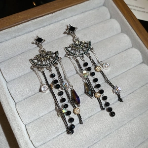 Detail of vintage silver fringe earrings with black beads and sparkling crystals
