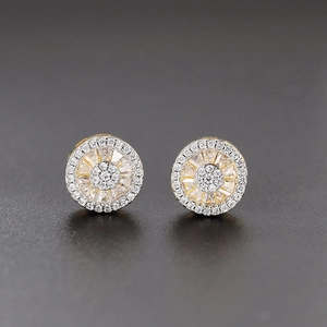 Close-up of gold hip hop stud earrings with micro-pave round and baguette cubic zirconia