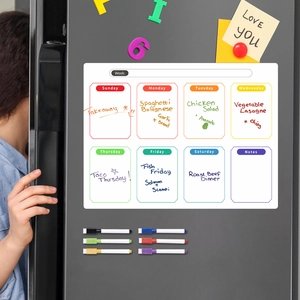 Close-up of magnetic weekly meal planner on fridge with six colorful dry erase markers
