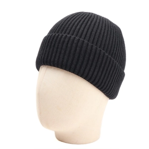 Detailed view of the black ribbed knit texture and wide cuff on the winter beanie hat
