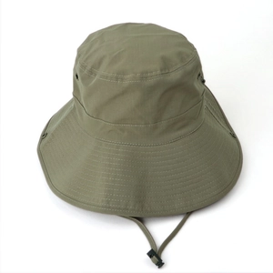 Detail of army green sun hat showing quick-dry ripstop texture and adjustable chin strap