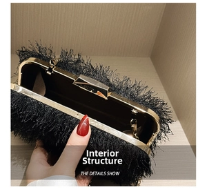 Internal structure of black tassel evening bag with gold metal frame and dark lining