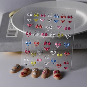 Relief nail art stickers featuring colorful bikini and swimsuit designs for summer manicure