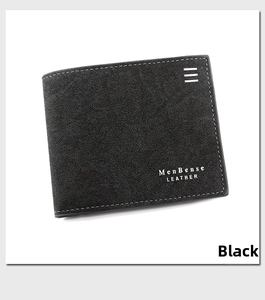 Detail of black bifold leather wallet with white stitching and brand logo