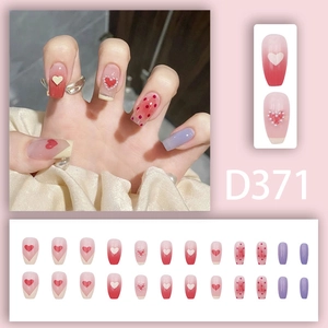 Sweet pink heart press-on nails with pearl accents and gradient blush design