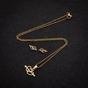Golden stainless steel jewelry set featuring hollow double hearts and arrow pendant
