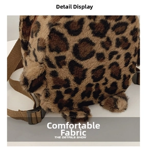 Detailed macro view of soft faux fur leopard print fabric and brown woven strap