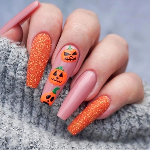 Halloween long coffin press-on nails featuring orange glitter and pumpkin head hand-painted art
