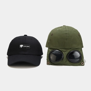 Hip-hop baseball cap with integrated aviator goggles and handmade patch decoration