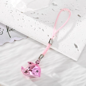 Detailed view of a shiny pink metal dolphin charm with a matching braided phone strap