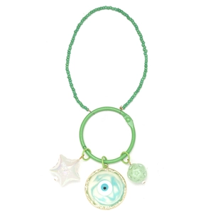 Close-up of green beaded keychain with Good Luck star and Evil Eye charms