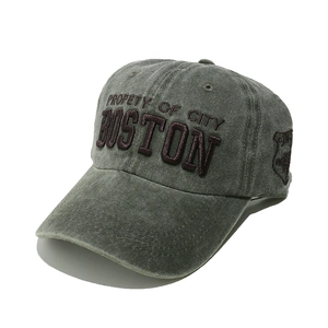 Detail of BOSTON embroidery and shield patch on vintage washed cotton baseball cap