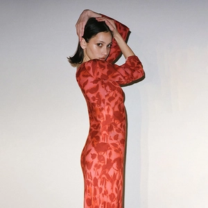 Detailed side view of a red floral long sleeve maxi dress featuring vintage print pattern