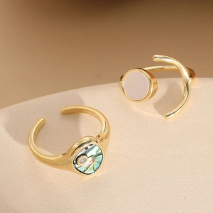 Elegant gold open rings set with abalone shell, white mother of pearl and zircon stones