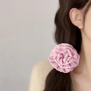 Detail of pink lace rose hair scrunchie shown on hair for a sweet elegant style
