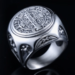 Macro shot of silver St. Benedict Medal ring with detailed religious engravings