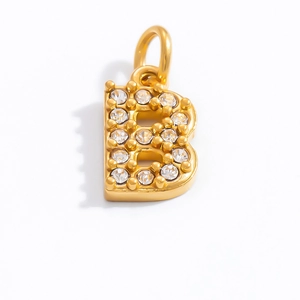 Macro shot of 18K gold plated letter B pendant with white crystal inlay for necklaces