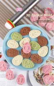 Close-up of Easter 3D egg-shaped cookie molds with rabbit patterns and stainless rolling pin